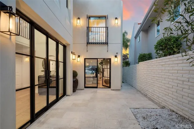 a view of a roof deck with couches and city view