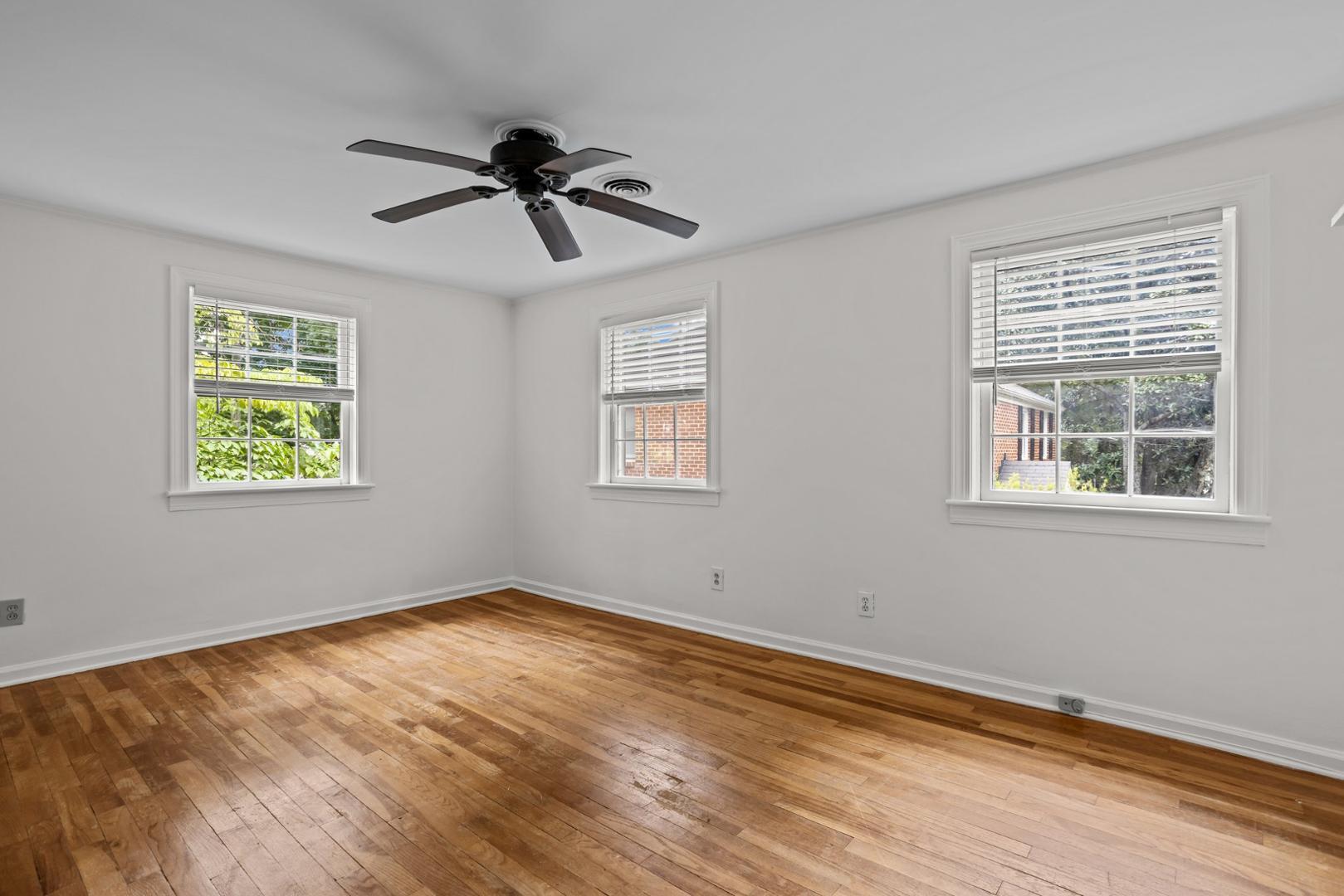 921 St Marys Street Raleigh, NC 27605 - Photo 16 of 42 a view of empty room with wooden floor and fan
