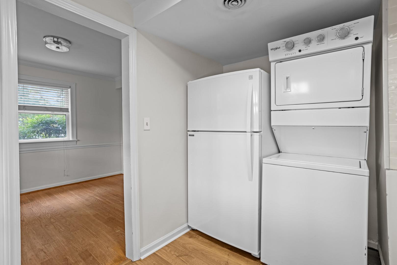 921 St Marys Street Raleigh, NC 27605 - Photo 7 of 42 a view of a storage & utility room with washer and dryer