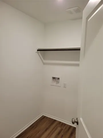 a view of small space with racks on the wall