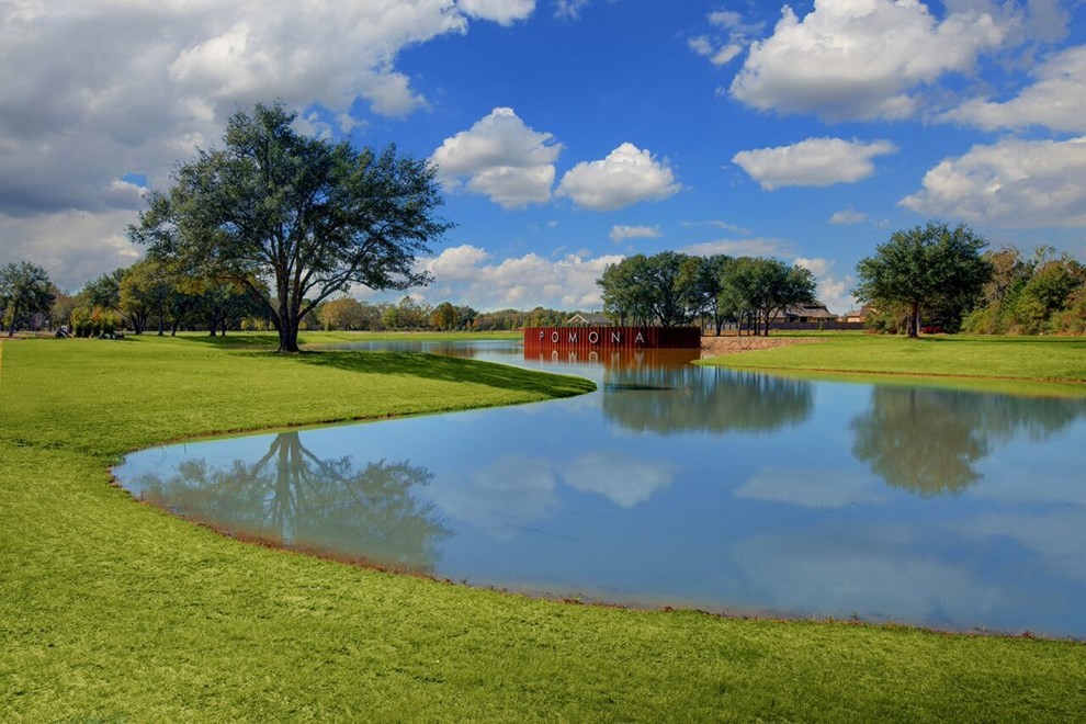 5523 Bonfire Alley Manvel, TX 77578 - Photo 13 of 19 a view of a lake with houses in the background
