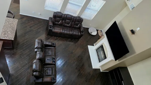 a view of a hallway with a livingroom and a bathroom
