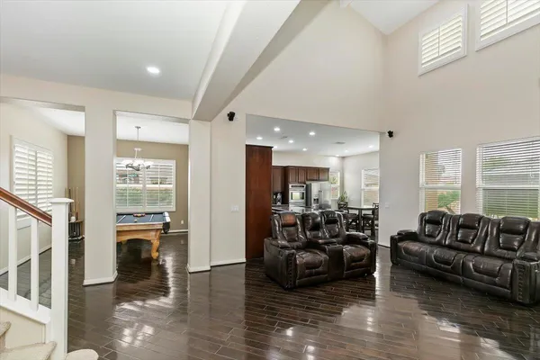 a living room with furniture window and wooden floor