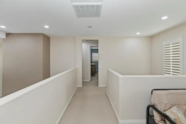 a view of a hallway with staircase