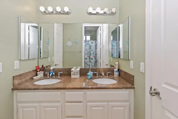 a bathroom with sinks sinks and a mirror