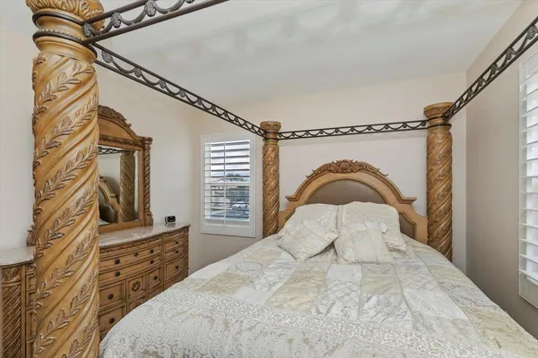 a bedroom with a bed and a dresser