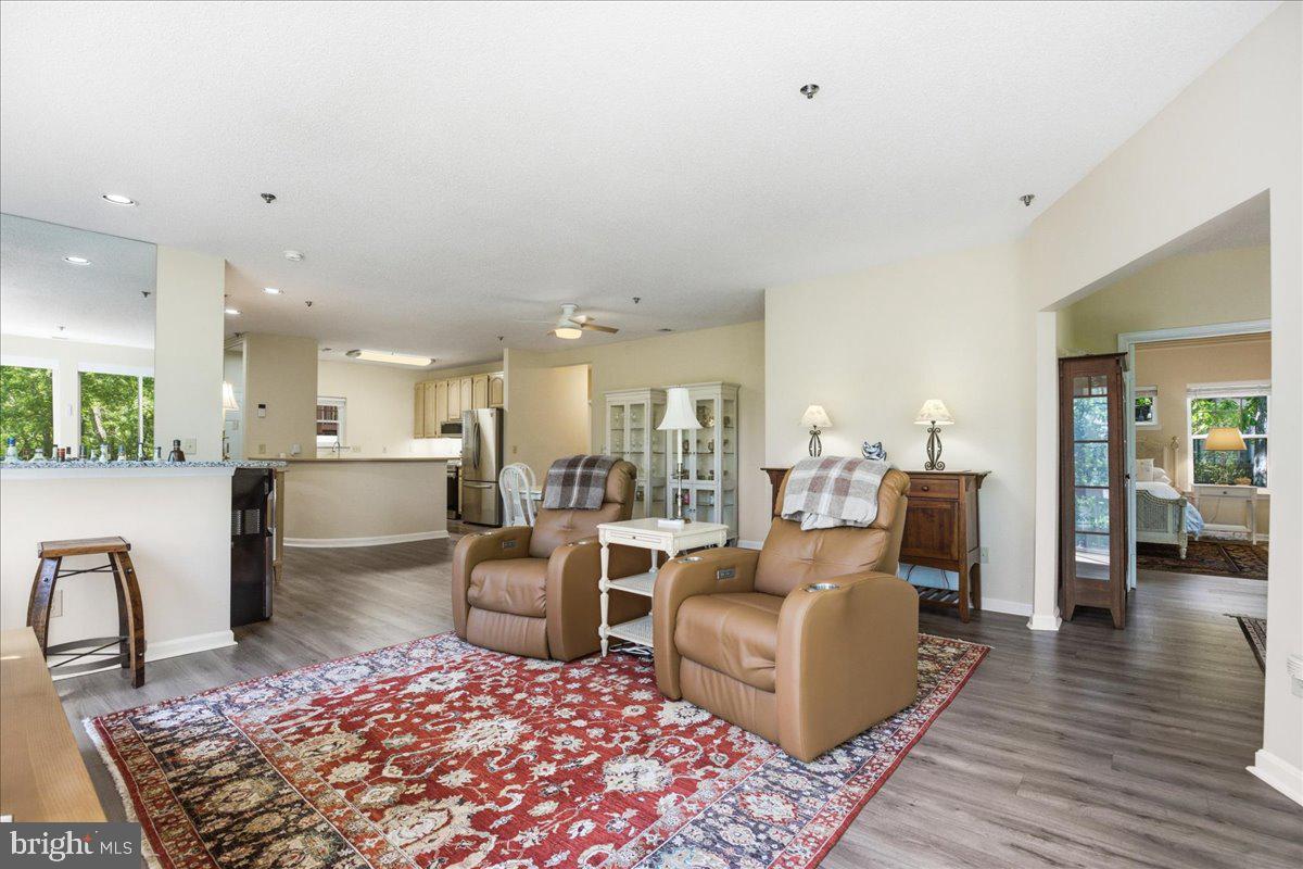 1126 Back Creek Loop, Unit 1126 Solomons, MD 20688 - Photo 24 of 47 a living room with furniture and a rug