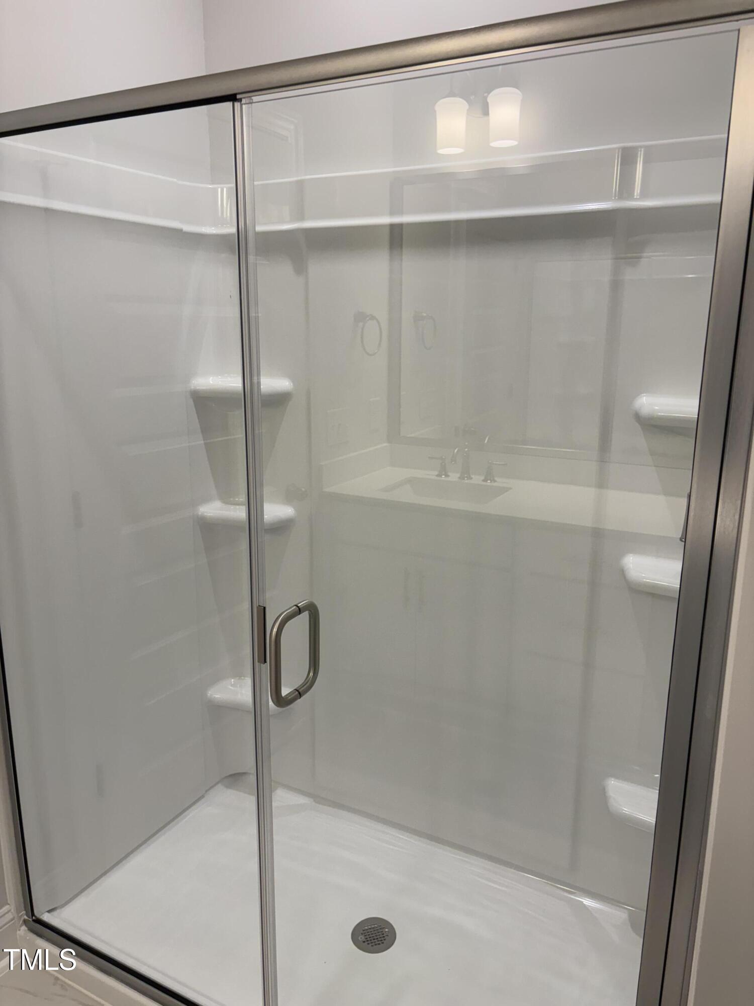 621 Weather Ridge Lane, Unit 33 Cary, NC 27513 - Photo 10 of 20 a bathroom with a shower