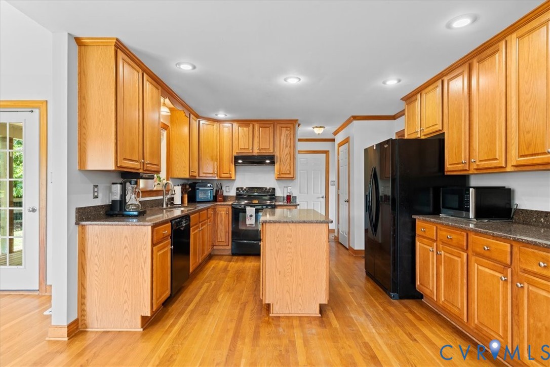3137 Trenholm Road Powhatan, VA 23139 - Photo 17 of 72 a kitchen with stainless steel appliances a refrigerator sink and cabinets