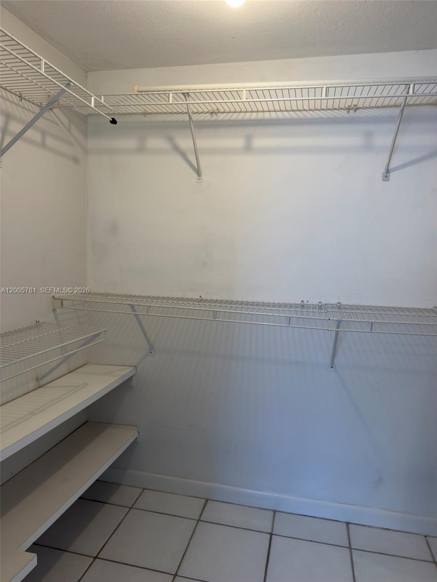3052 Southwest 27th Avenue, Unit 204 Miami, FL 33133 - Photo 28 of 29 bedroom walk in closet