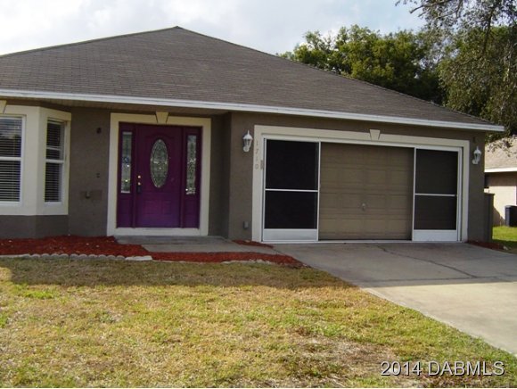 1710 Concert Road Deltona, FL 32738 - Photo 1 of 20 a front view of a house