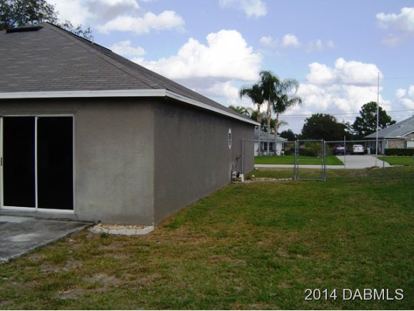 1710 Concert Road Deltona, FL 32738 - Photo 18 of 20 a backyard of a house