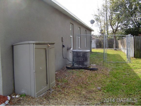 1710 Concert Road Deltona, FL 32738 - Photo 19 of 20 a view of a house with backyard and trees