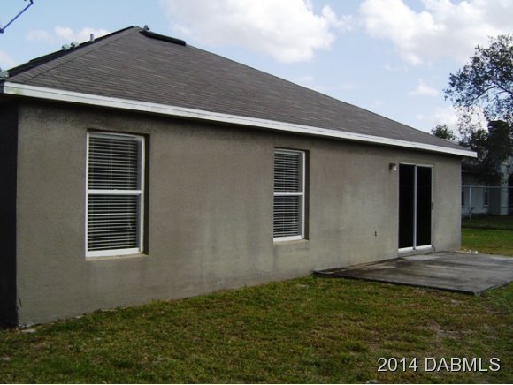 1710 Concert Road Deltona, FL 32738 - Photo 20 of 20 a house with yard in front of it