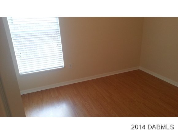 1710 Concert Road Deltona, FL 32738 - Photo 5 of 20 a open kitchen with a white wall and a window