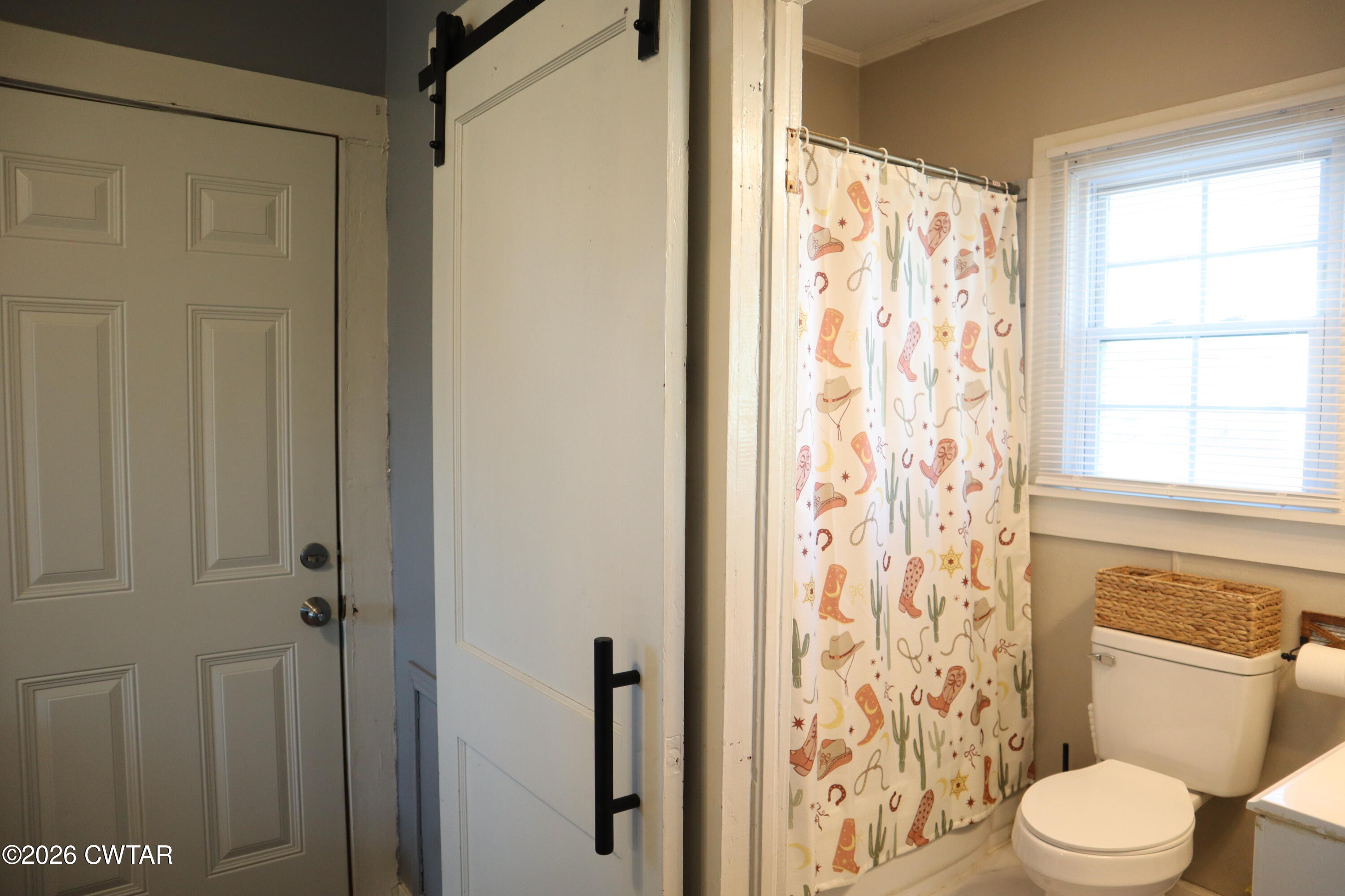 4817 R J Welch Road Friendship, TN 38034 - Photo 11 of 18 a white toilet sitting next to a shower curtain
