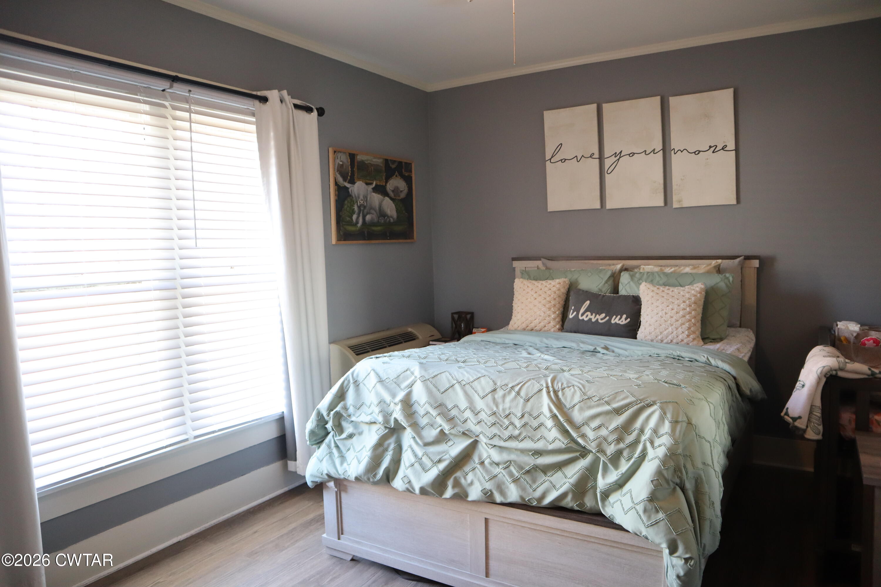 4817 R J Welch Road Friendship, TN 38034 - Photo 13 of 18 a bed sitting in a bedroom next to a window