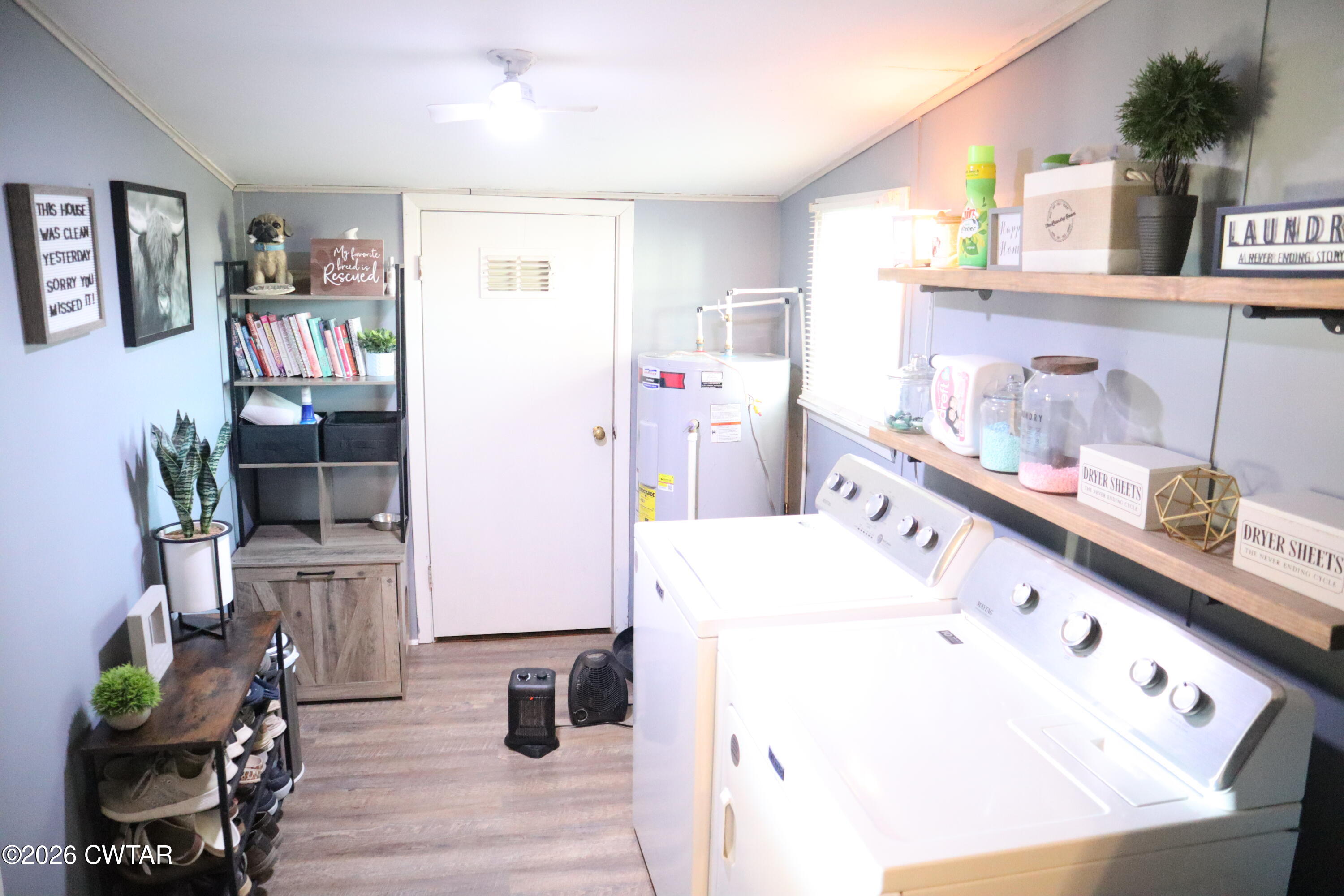 4817 R J Welch Road Friendship, TN 38034 - Photo 16 of 18 a room with microwave cabinets and wooden floor