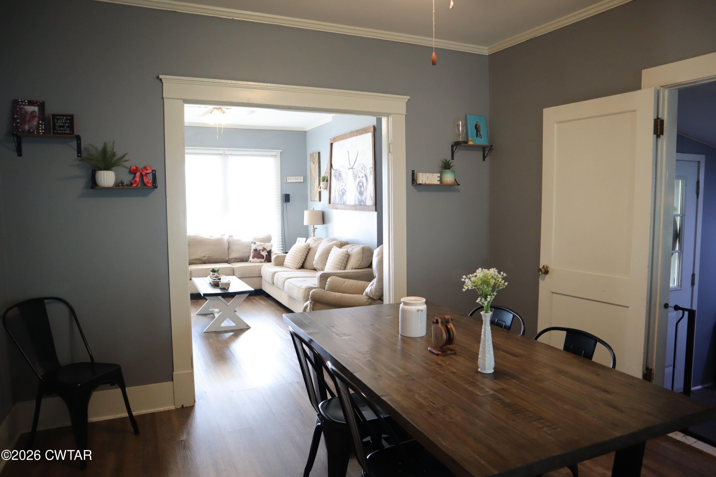4817 R J Welch Road Friendship, TN 38034 - Photo 5 of 18 a view of a dining room with furniture and wooden floor