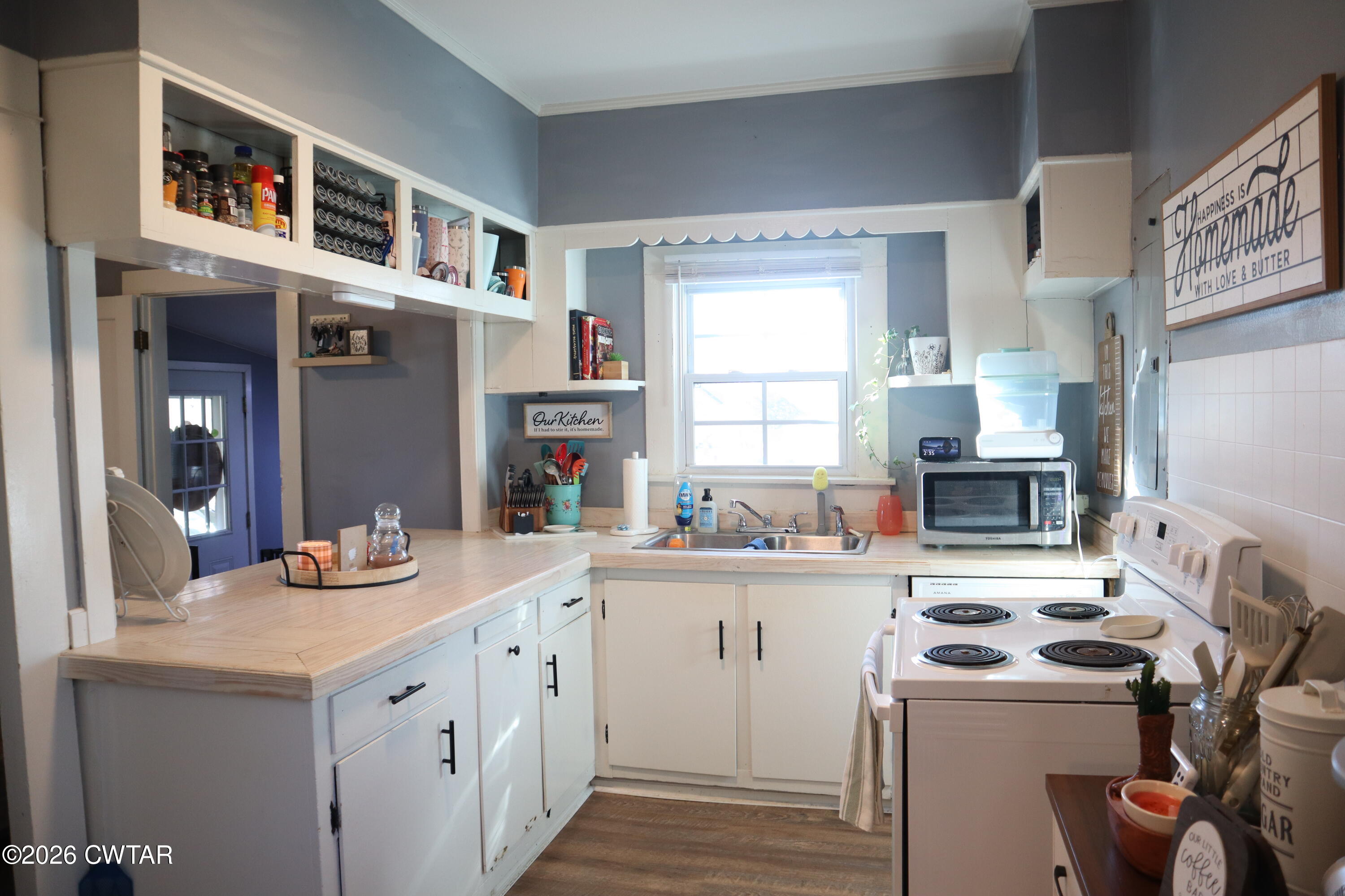 4817 R J Welch Road Friendship, TN 38034 - Photo 6 of 18 a kitchen with a sink stove and cabinets