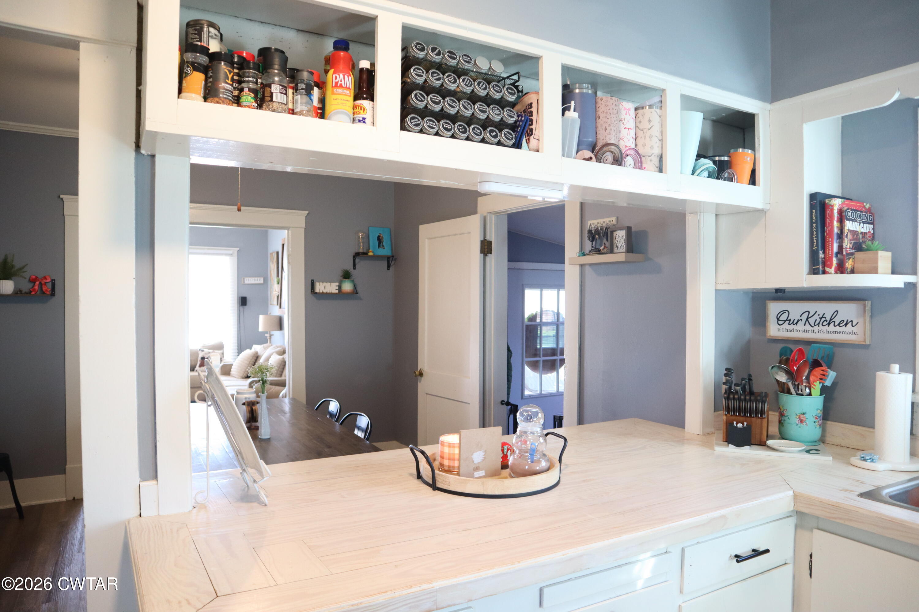 4817 R J Welch Road Friendship, TN 38034 - Photo 7 of 18 a dining room with furniture and a book shelf