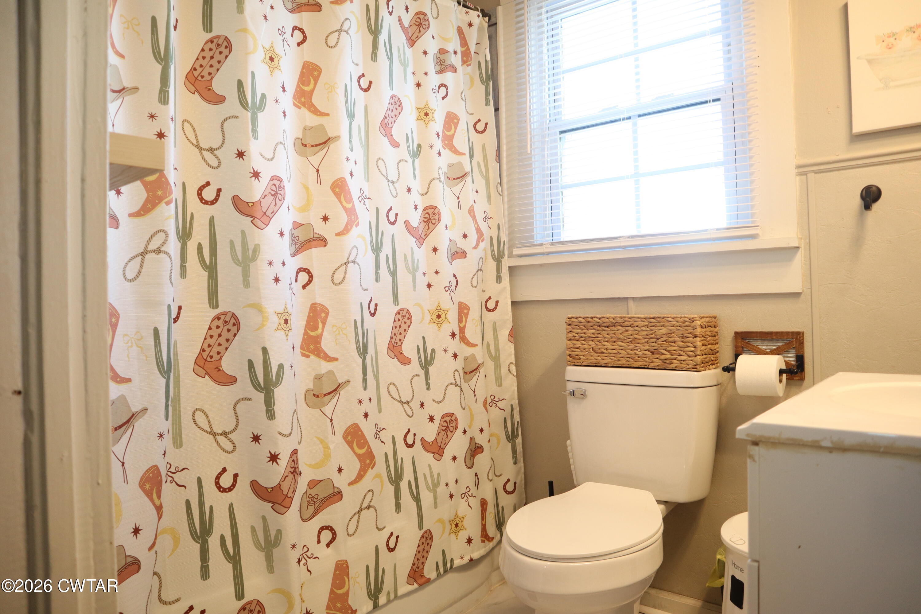 4817 R J Welch Road Friendship, TN 38034 - Photo 10 of 18 a white toilet sitting next to a window