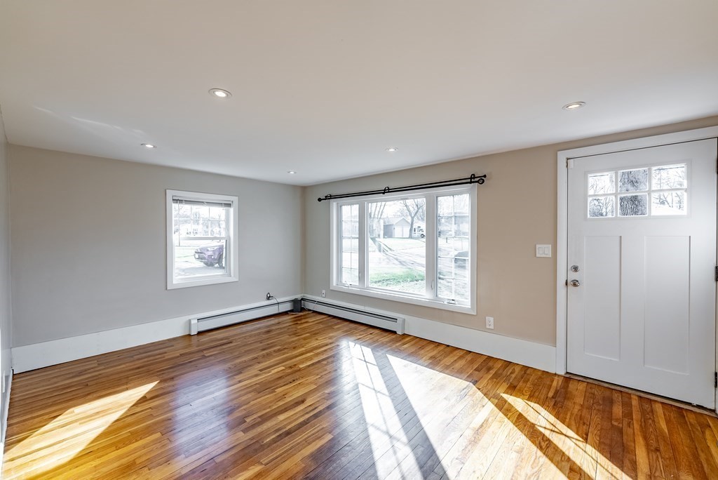 22 Ridge Road South Hadley, MA 01075 - Photo 13 of 36 a view of an empty room with a window and wooden floor