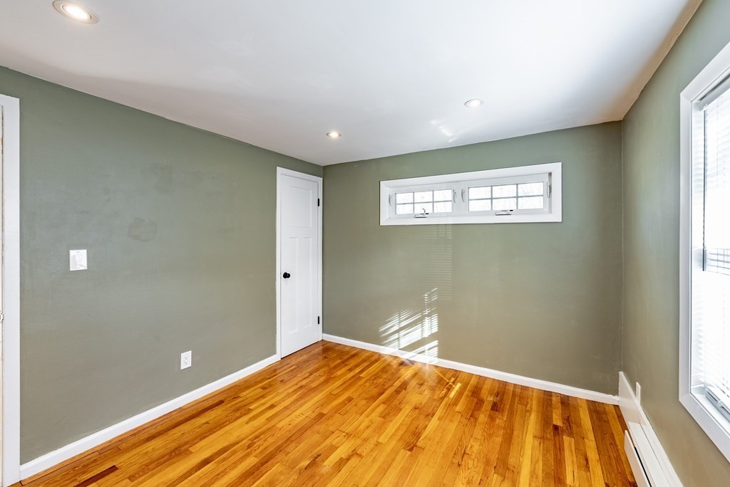 22 Ridge Road South Hadley, MA 01075 - Photo 18 of 36 a view of a big room with wooden floor and windows