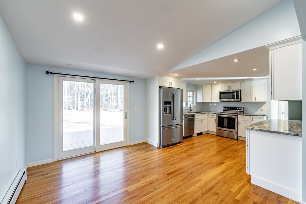 22 Ridge Road South Hadley, MA 01075 - Photo 3 of 36 a kitchen with stainless steel appliances granite countertop a refrigerator and a stove top oven