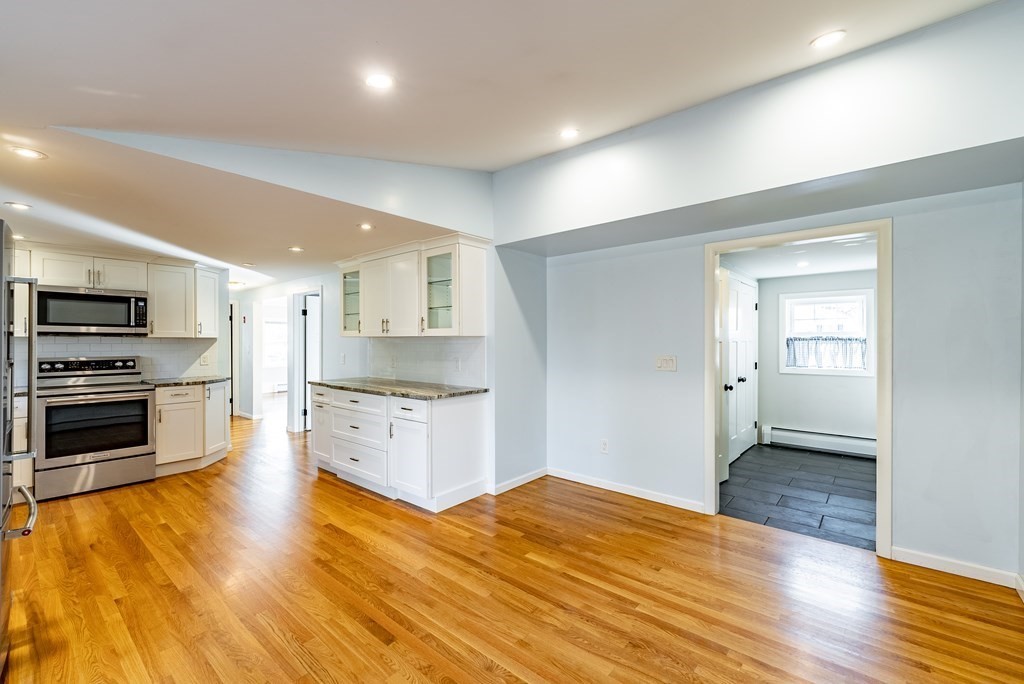 22 Ridge Road South Hadley, MA 01075 - Photo 5 of 36 a kitchen with stainless steel appliances kitchen island granite countertop a stove top oven and sink