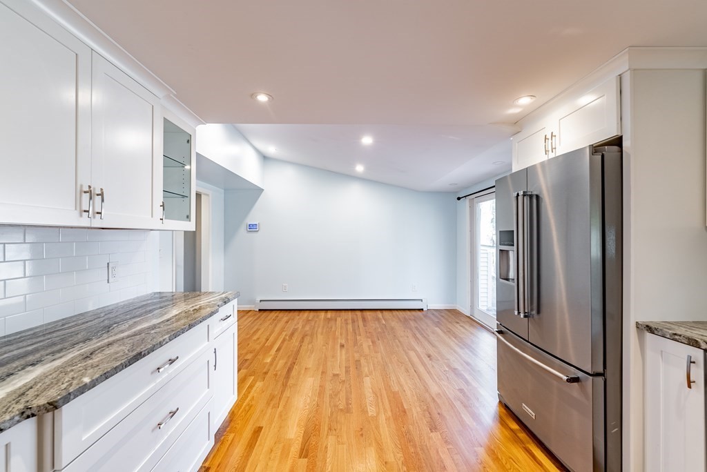 22 Ridge Road South Hadley, MA 01075 - Photo 9 of 36 a view of a kitchen with a refrigerator and wooden floor