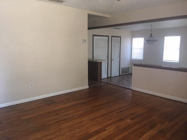 523 55th Street Lubbock, TX 79404 - Photo 2 of 9 a view of empty room with wooden floor and window