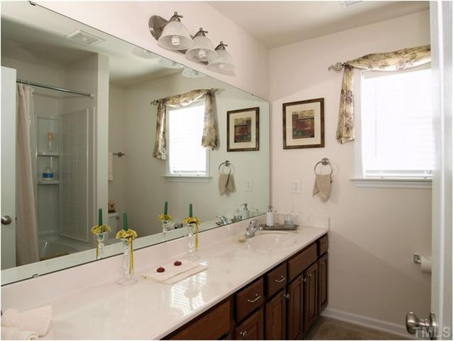 1912 Grace Point Road Morrisville, NC 27560 - Photo 13 of 25 Huge full bath on second level for the secondary bedrooms. Tub/shower combination and tile floors! Bathroom