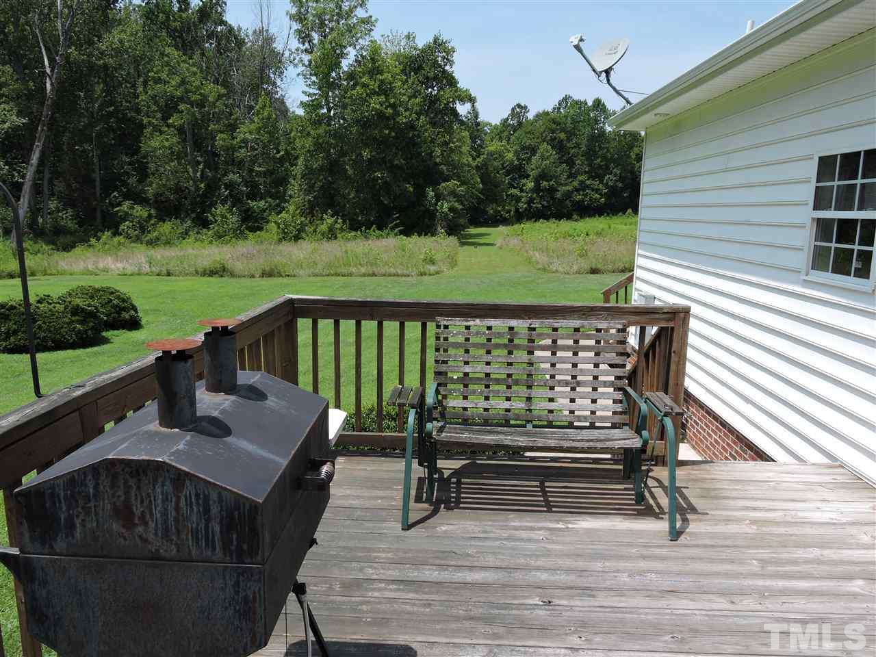 5013 Bill Poole Road Rougemont, NC 27572 - Photo 14 of 16 a view of a two chairs in the deck