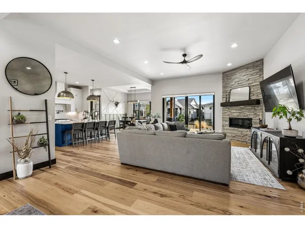 a living room with fireplace furniture and a flat screen tv