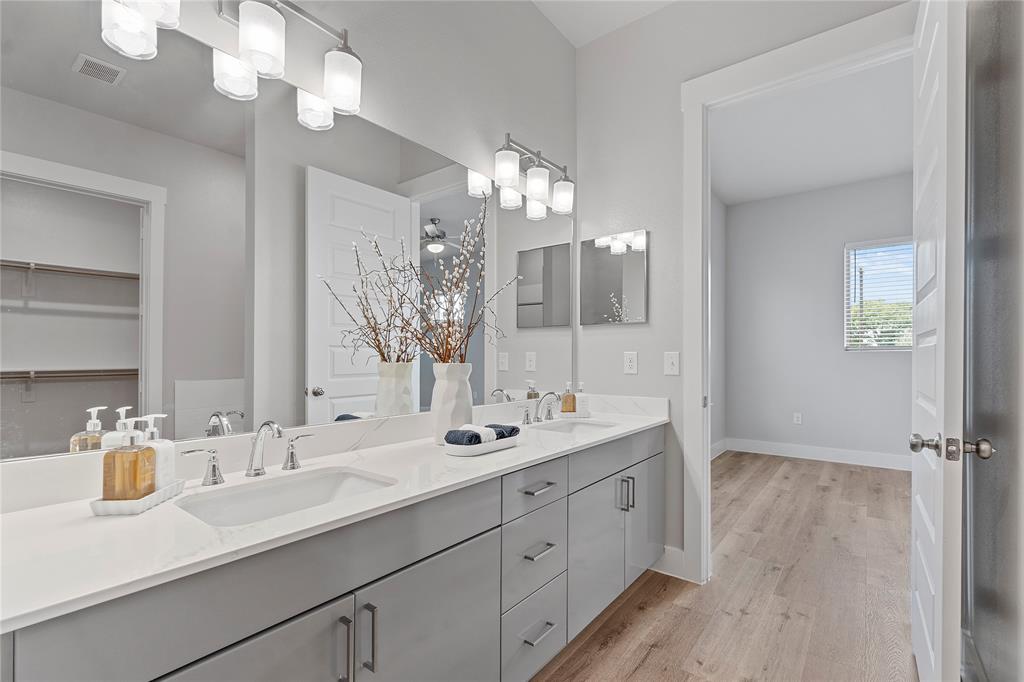 579 Lloyd's Road, Unit 820B Little Elm, TX 75068 - Photo 12 of 37 a bathroom with a sink double vanity and a mirror