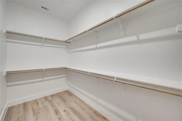 a view of an empty walk in closet