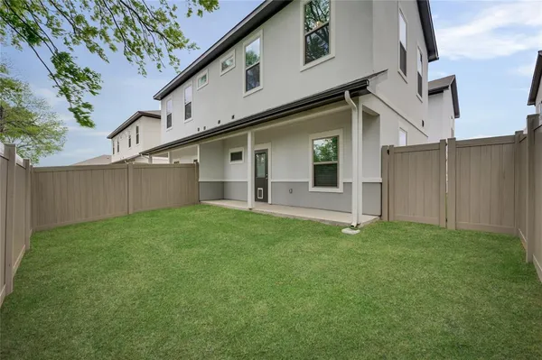 a backyard of a house with lots of green space