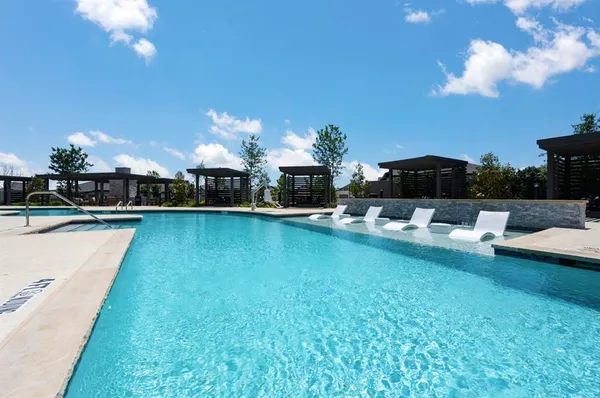 a view of a swimming pool with a patio
