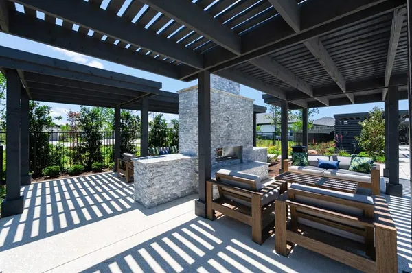 a outdoor space with patio lots of furniture and garden view