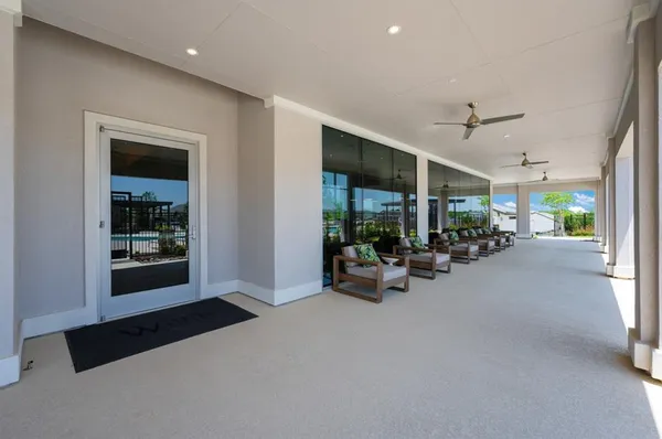 a lobby with furniture and a large window