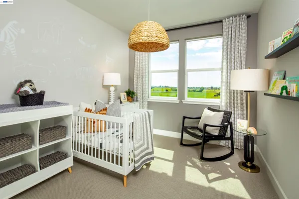 a bedroom with furniture and a window