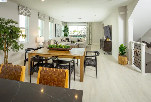 a view of a dining room with furniture and window