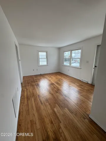 a view of livingroom with hardwood floor and window