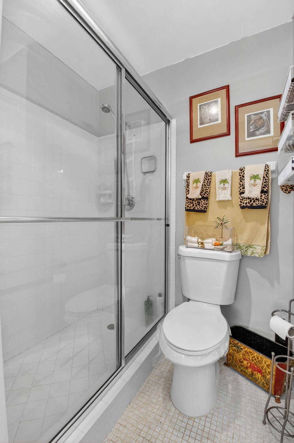 13757 Flora Place, Unit G Delray Beach, FL 33484 - Photo 21 of 58 a white toilet sitting next to a bathroom sink