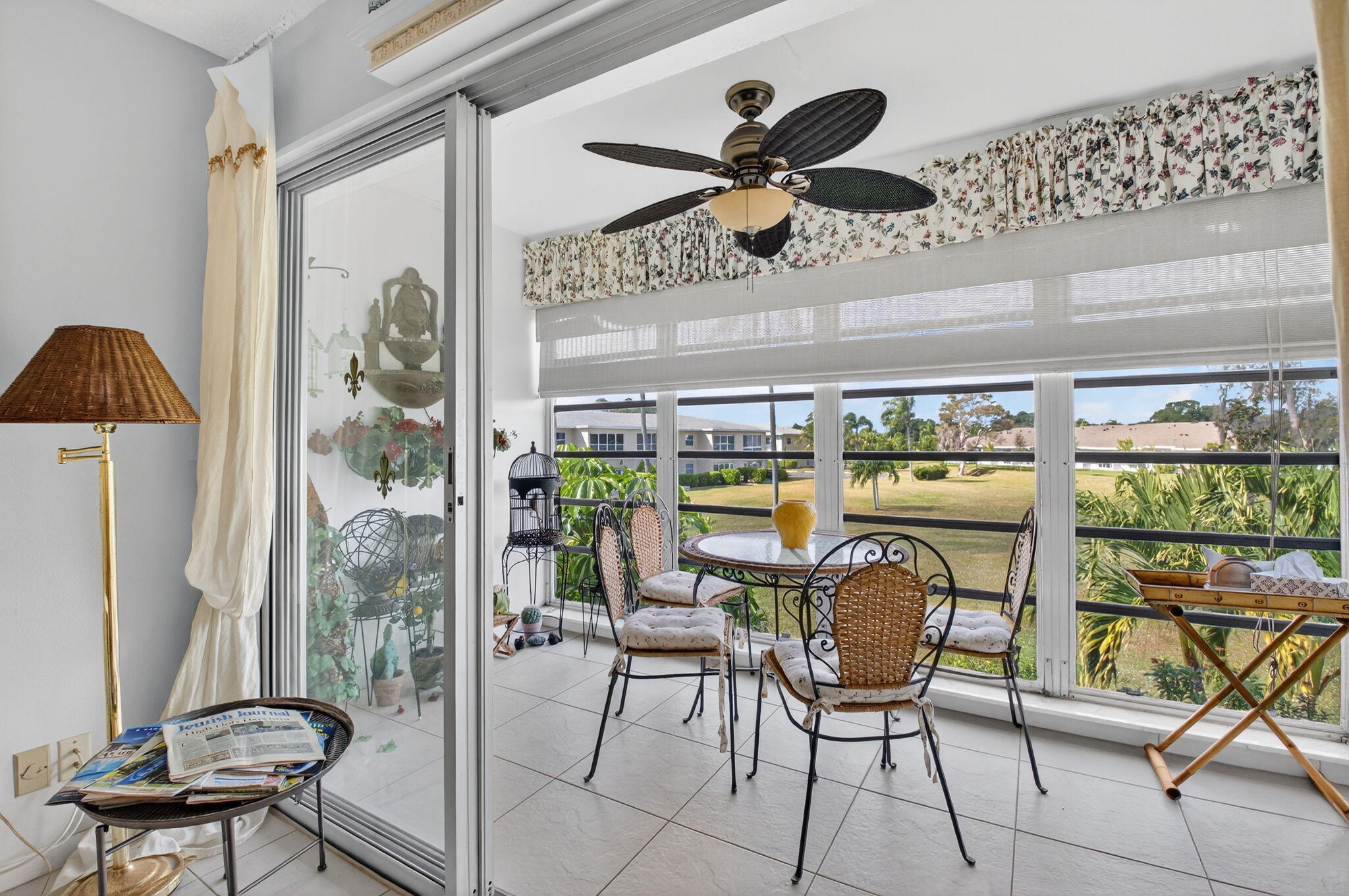 13757 Flora Place, Unit G Delray Beach, FL 33484 - Photo 23 of 58 a view of a dining room with furniture window and outside view