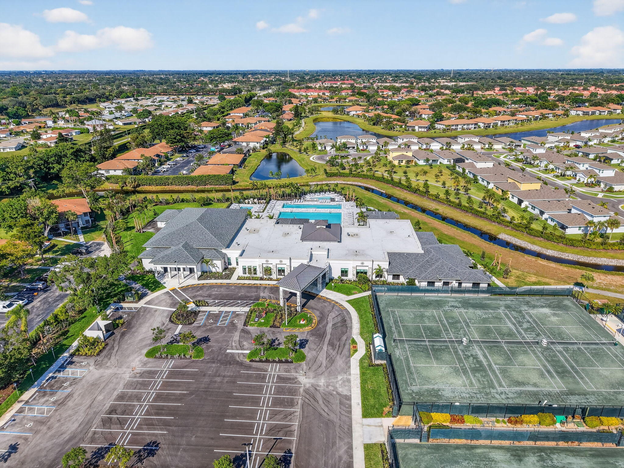 13757 Flora Place, Unit G Delray Beach, FL 33484 - Photo 49 of 58 an aerial view of residential building and lake