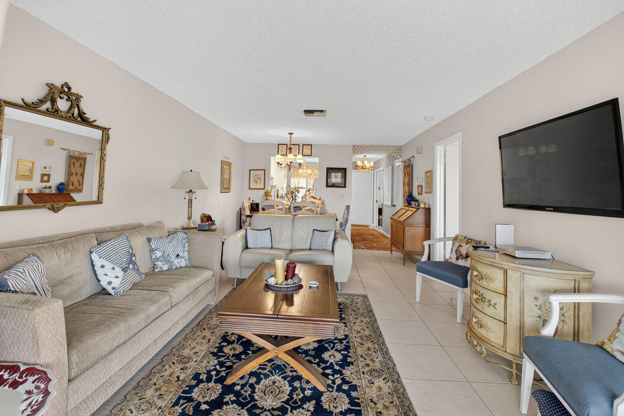 13757 Flora Place, Unit G Delray Beach, FL 33484 - Photo 10 of 58 a living room with furniture and a flat screen tv