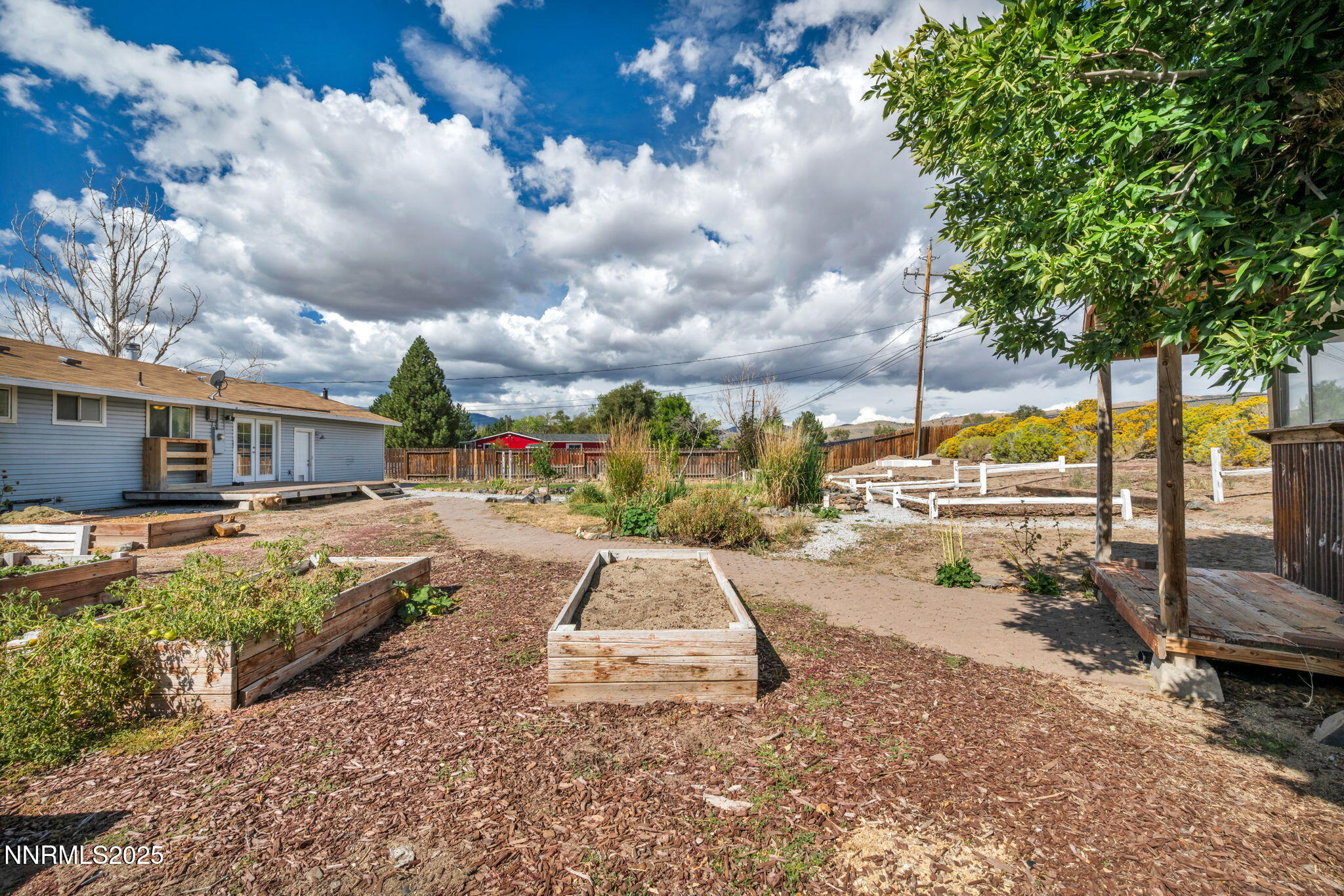 17475 Egret Lane Reno, NV 89508 - Photo 14 of 67 a view of a swimming pool with a lounge chairs