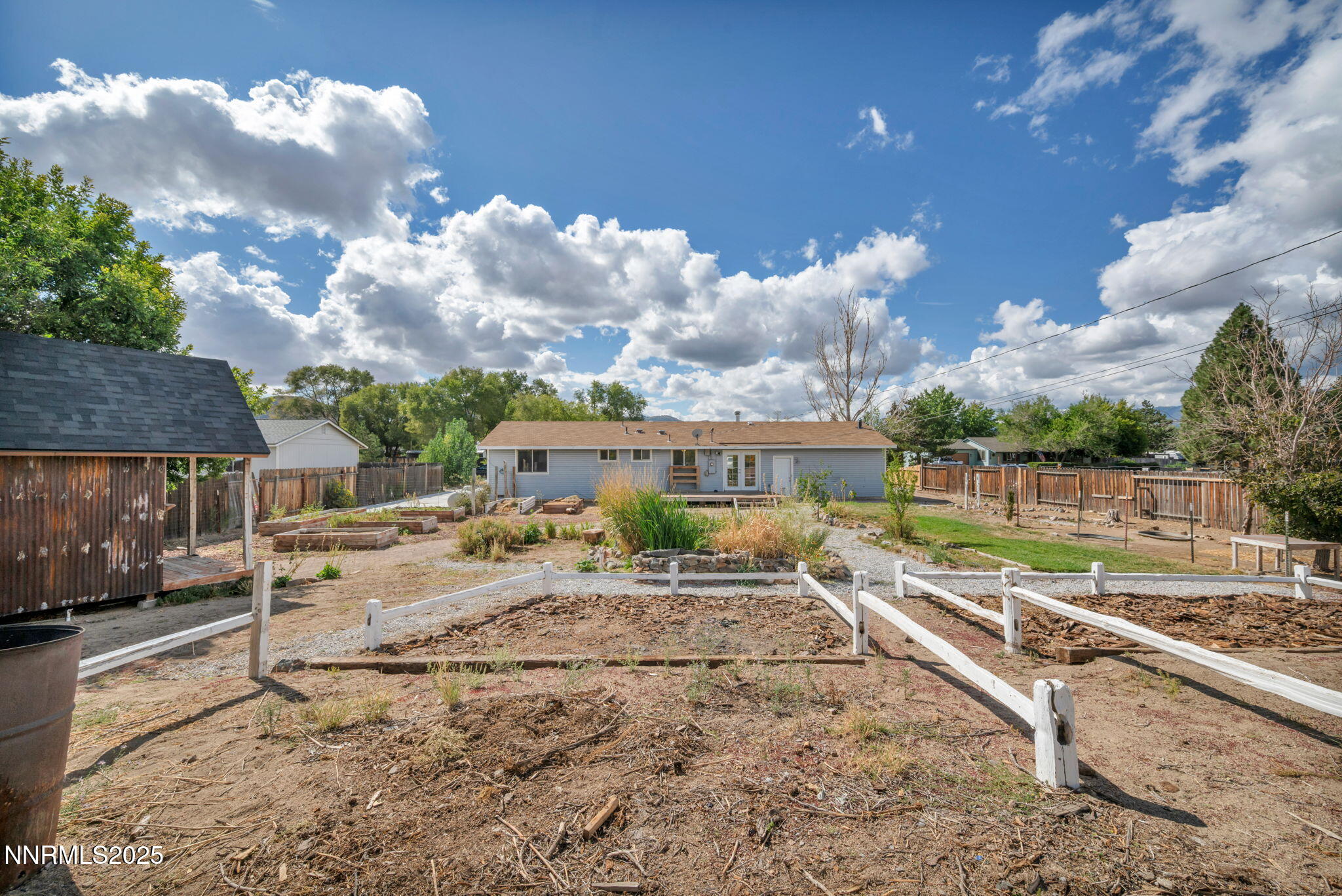 17475 Egret Lane Reno, NV 89508 - Photo 18 of 67 a view of a house with a backyard and a chair
